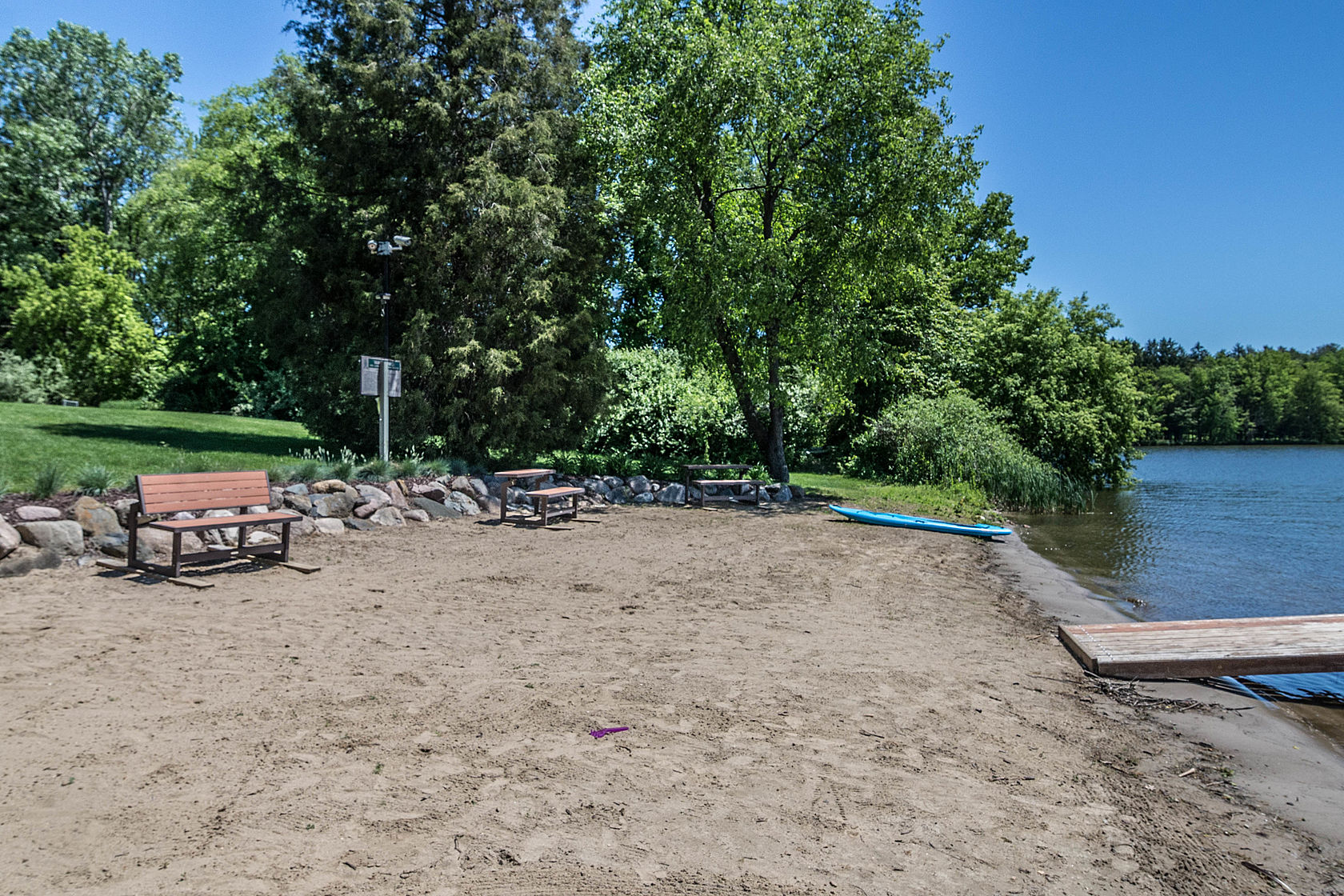 Sandy beaches and recreational amenities at Pine Creek lake in Brighton